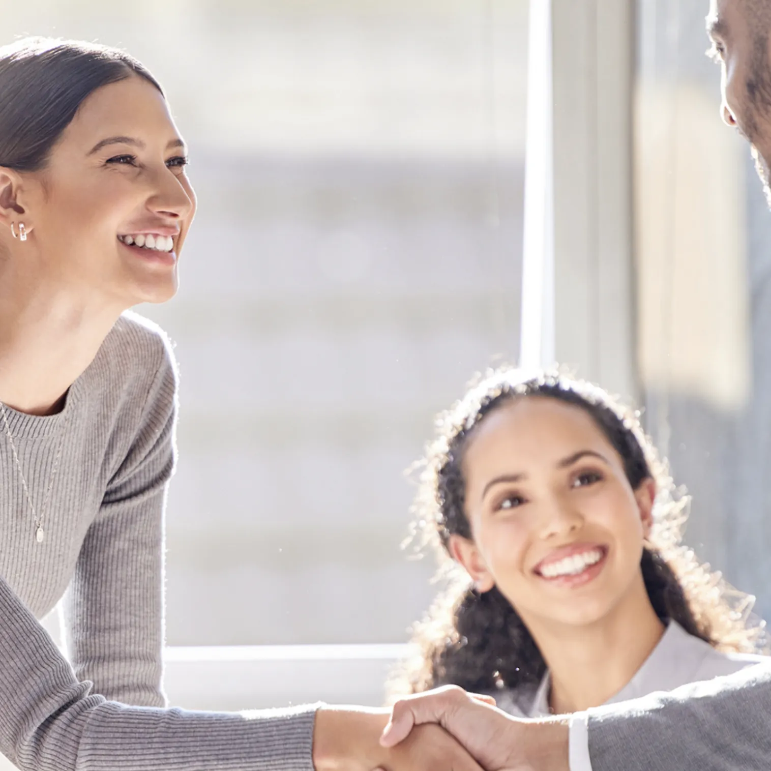 Friendly Introduction Avispa recruiter shaking hands with a candidate at an introduction