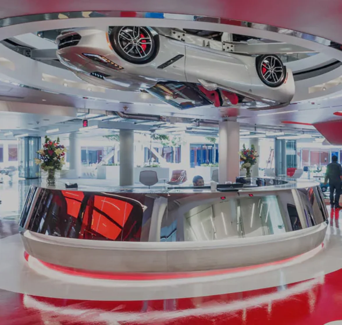 Car Suspended in Room A car suspended from the ceiling of an Edmunds office