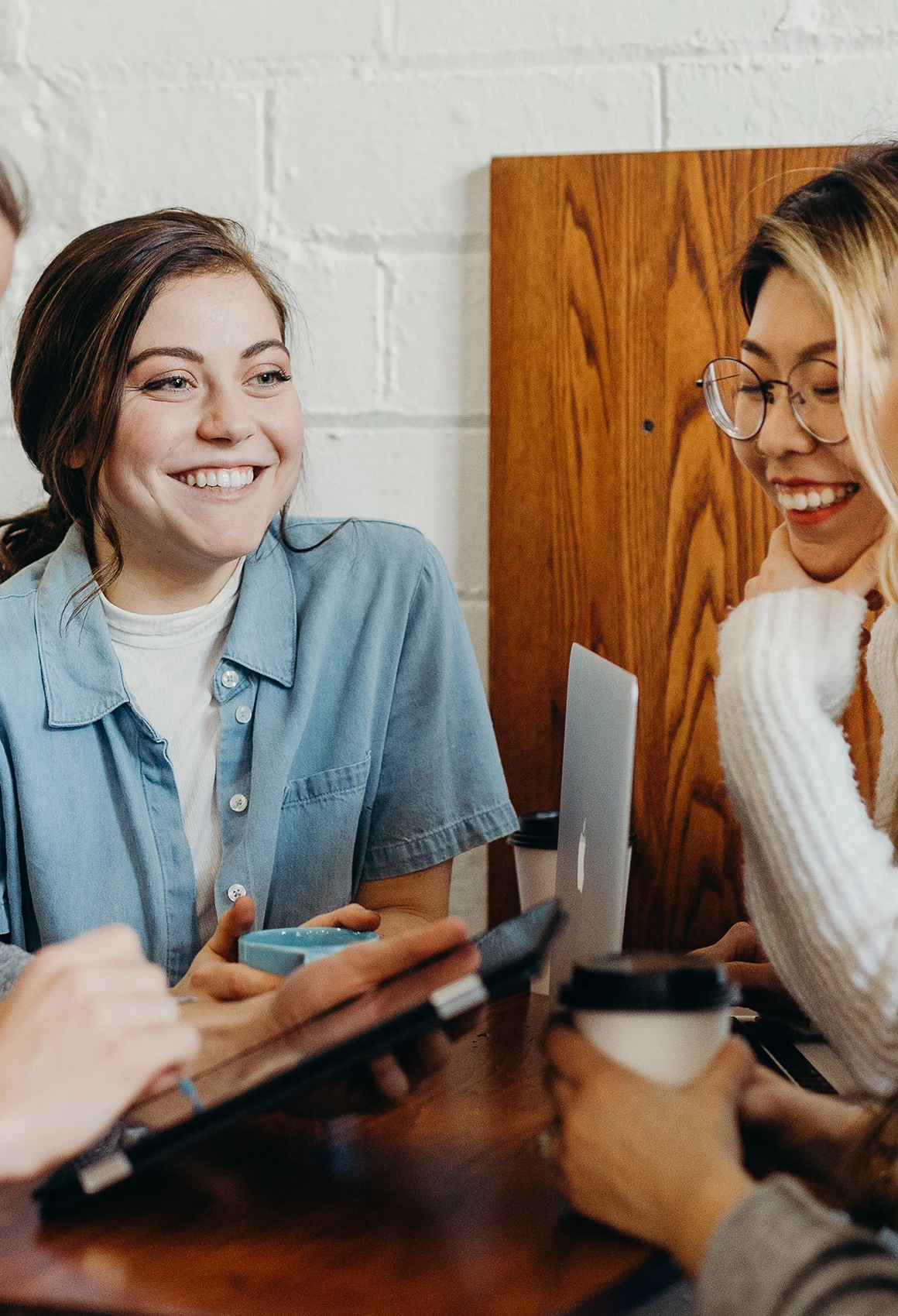 Joyful Moment Two recruiting advisors talking over coffee